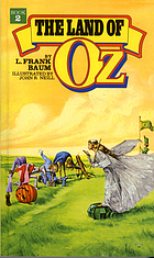The land of Oz : being an account of the further adventures of the Scarecrow and Tin Woodman and also the strange experiences of the Highly Magnified Woggle-Bug, Jack Pumpkinhead, the Animated Saw-horse and the Gump ; the story being a sequel to The Wizard of Oz